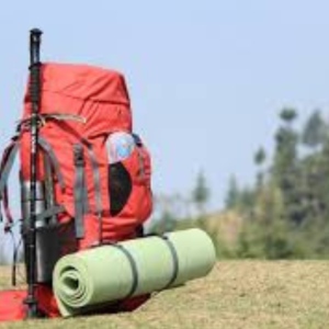 Essential gear for a 2-day Toubkal trek including a backpack, trekking poles, headlamp, gloves, helmet, and compact mountain essentials arranged neatly on a flat surface. Essential gear for a 2-day Toubkal trek including a backpack, trekking poles, headlamp, gloves, helmet, and compact mountain essentials arranged neatly on a flat surface.
