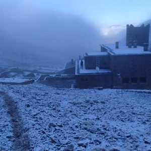 Snow-dusted Mount Toubkal peaks under changing weather in the Atlas Mountains, Morocco Snow-dusted Mount Toubkal peaks under changing weather in the Atlas Mountains, Morocco