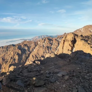 Panoramic view from the summit of Mount Toubkal overlooking High Atlas valleys, capturing the experience of the Mount Toubkal 2 day trek. Panoramic view from the summit of Mount Toubkal overlooking High Atlas valleys, capturing the experience of the Mount Toubkal 2 day trek.