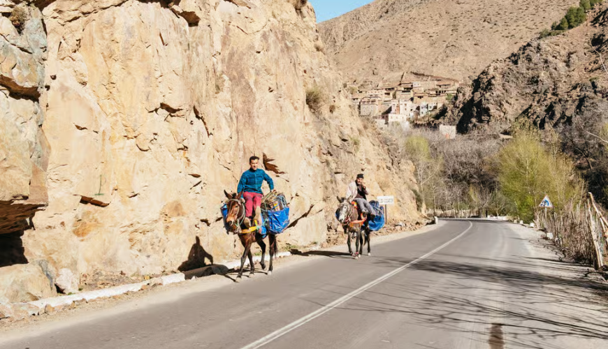 Marrakech to Imlil road transitioning from city landscape to High Atlas foothills