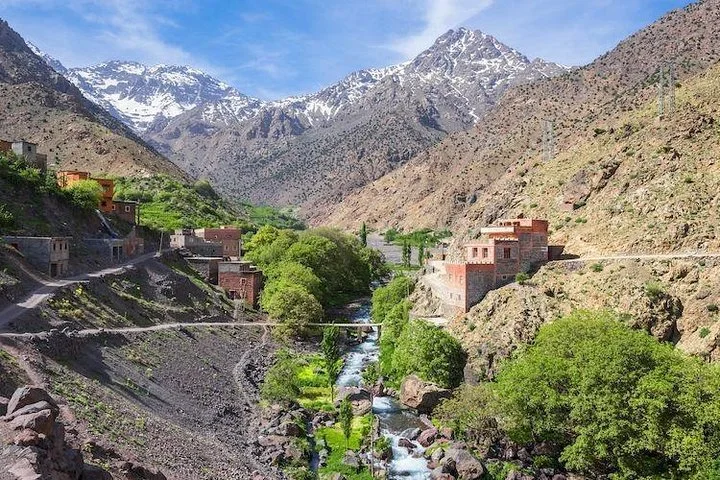 Terraced fields and irrigation channels in Imlil Valley showing the blend of Amazigh agriculture and mountain landscape. Terraced fields and irrigation channels in Imlil Valley showing the blend of Amazigh agriculture and mountain landscape.