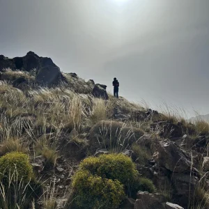 A guide from Imlil with visitors enjoying a view of the Moroccan Imlil Valley A guide from Imlil with visitors enjoying a view of the Moroccan Imlil Valley