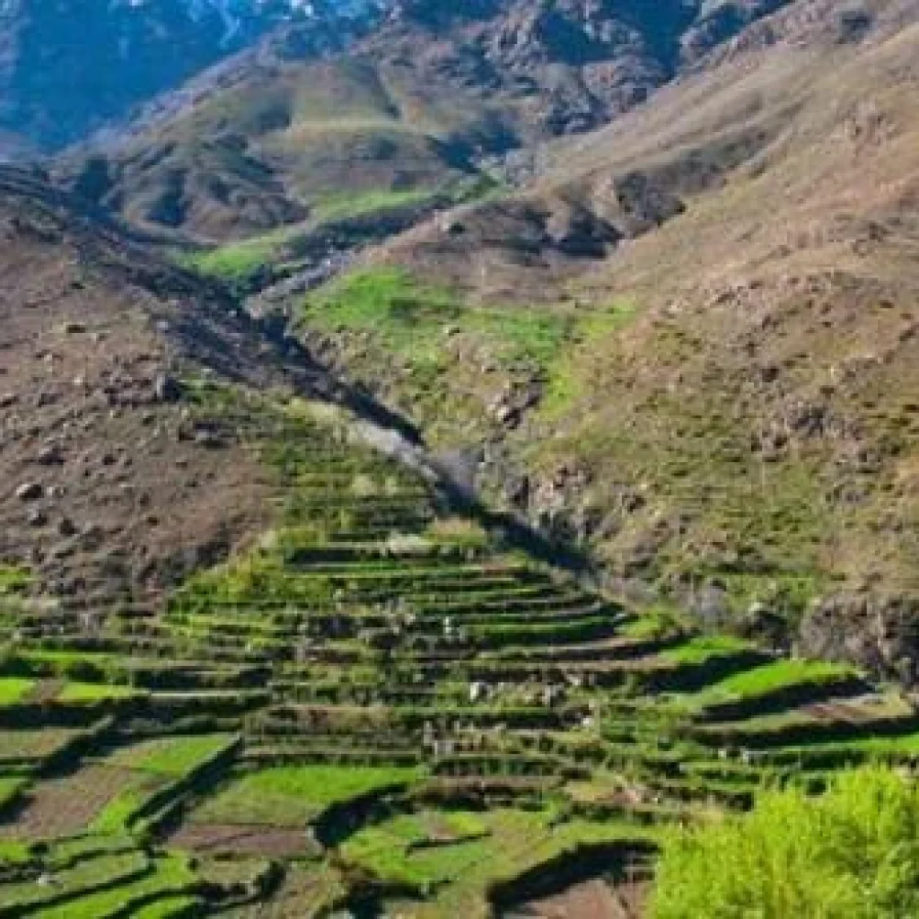 Traditional earthen village near Imlil Morocco with terraced fields